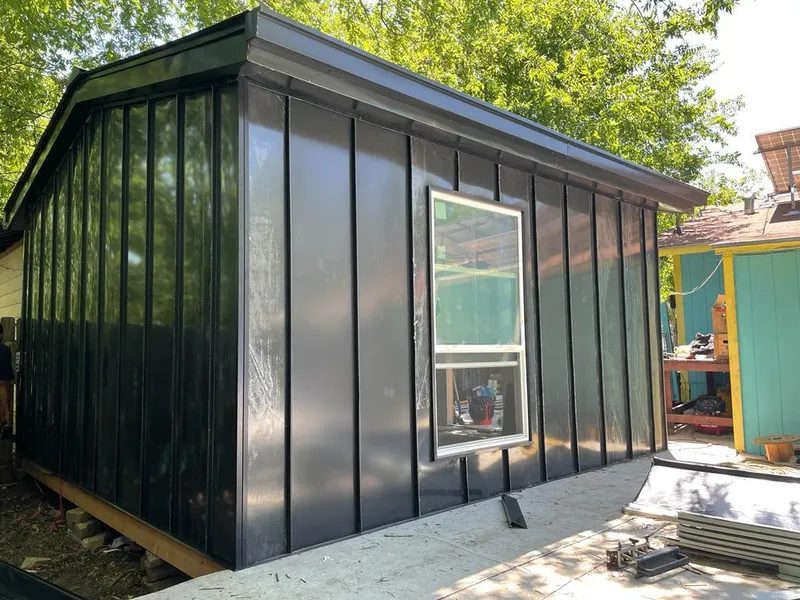 Black standing seam metal wall panels for Roof Inspection in Walled Lake